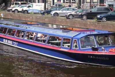 Amsterdam canal cruise blue boat