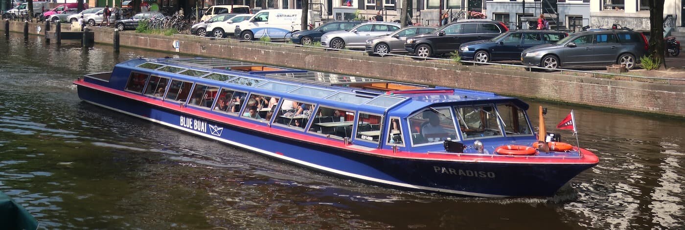 Amsterdam canal cruise blue boat