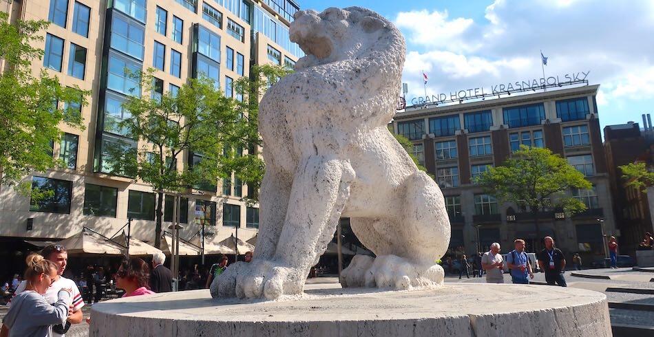 Lion sculpture beside the National Monument on Dam Square, Amsterdam